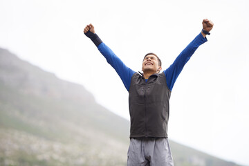 Man, hiker and winner on mountain peak and happy with progress, exercise and victory. Hiking,...
