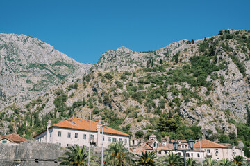 Fototapeta na wymiar Church of Our Lady of Remedy near rocky mountain. Kotor, Montenegro