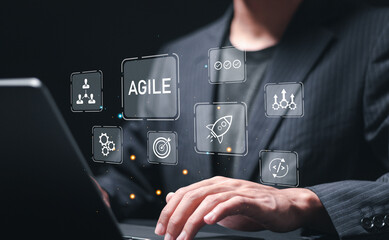 Agile development methodology, businessman use laptop with virtual screen of agile icons for process that will help you work faster By reducing step-by-step work and focusing on team communication. - obrazy, fototapety, plakaty