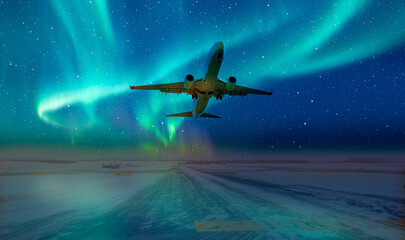 Commercical white airplane fly up over take-off runway the (ice) snow-covered airport with aurora...