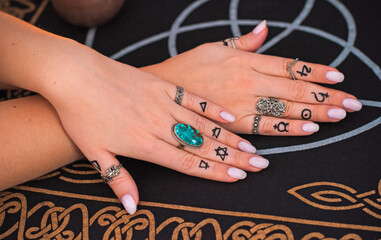 Meaning of rings on a finger. Esoteric and astrology symbol of ring. Scene with a ladies hand