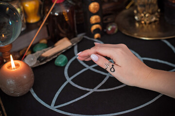 Meaning of rings on a finger. Esoteric and astrology symbol of ring. Scene with a ladies hand - obrazy, fototapety, plakaty