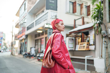 Gen z girl leather fashion with punk Asian woman tourist of local city Southeast Asia travel trendy...