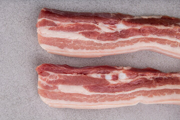 raw Porc bacon fresh on grey background 
