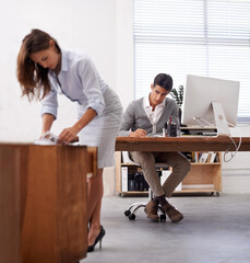 Affair, infidelity or sexual harassment with business man by desk at work, looking at bum of...