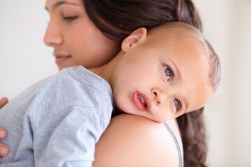 Mom holding baby boy in home for sleep, bonding and child care with support in morning. Woman, tired toddler and nap time together in bedroom with development, trust and safety with mothers love.