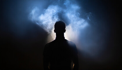 Silhouette of ghost,mans spirit on a dark background. And his shadow in smoke.death day concept, copy space.