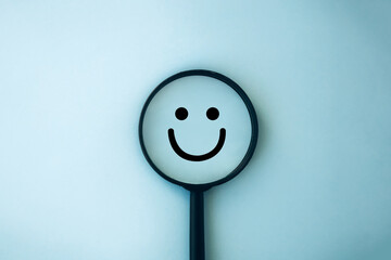Magnifying reveals smiley face icon. Mental health, positive thinking, growth mindset. Customer...