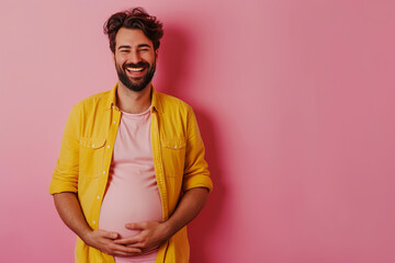 pregnant trans man with a big belly on a pastel pink background - obrazy, fototapety, plakaty