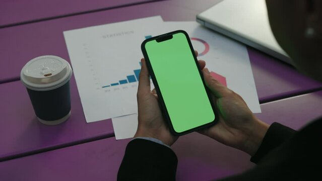 Lady Office Worker Hands Holding Mobile Phone with Green Screen Touching the Display. Woman Manager Doing Tap, Using Phone, Mockup. Chroma Key Template Screen Concept. Close Up