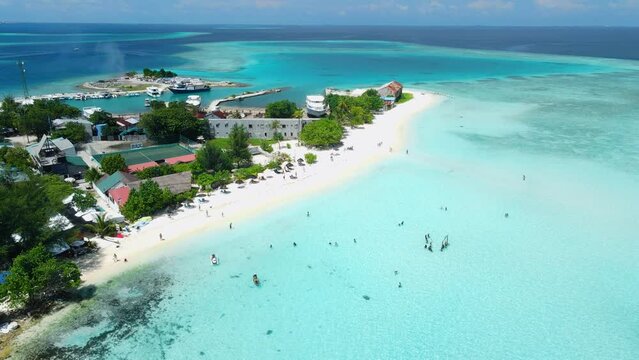 Aerial View of island near Maafushi on Kaafu Atoll. Tropical Island with clear ocean and beach, Maldives