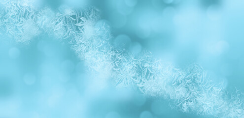 Fototapeta na wymiar Snow pattern. Light blue shiny winter blurred background. Template for graphic designers 