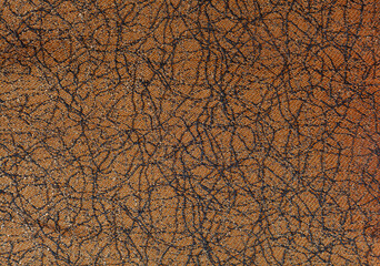 Orange fabric texture with abstract black threads