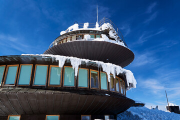 A modern, tourist shelter on the top of Mount Śnieżka in the Giant Mountains