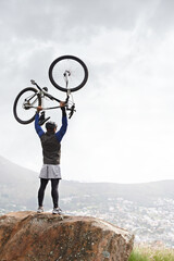 Back, success and a man with a bike on the mountains for training achievement or pride. Nature,...