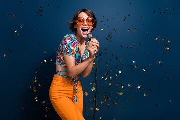Photo portrait of lovely young lady singing mic party energetic wear trendy flared pants garment...
