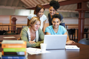 Teamwork, laptop or happy people studying in university, college or school campus for education. Library, elearning or group of students with scholarship, reading news, research or online course