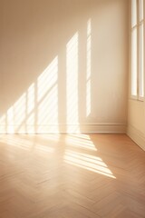Light beige wall and wooden parquet floor, sunrays and shadows from window