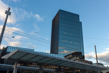 Naklejka premium Modern high-rise building made of glass and concrete near the train station in St. Gallen