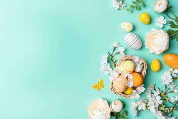 Happy Easter composition for easter design. Elegant Easter eggs and flowers on mint background....