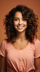 Fototapeta premium Beautiful smiling young woman with curly hairstyle and makeup on brown