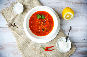 Red soup with sour cream and parsley