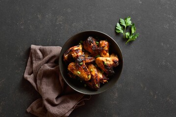 Grilled chicken wings in bowl