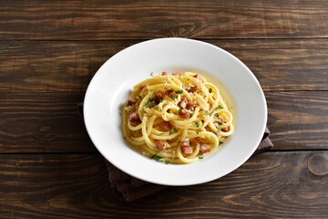 Carbonara pasta, spaghetti with crisp pancetta and black pepper