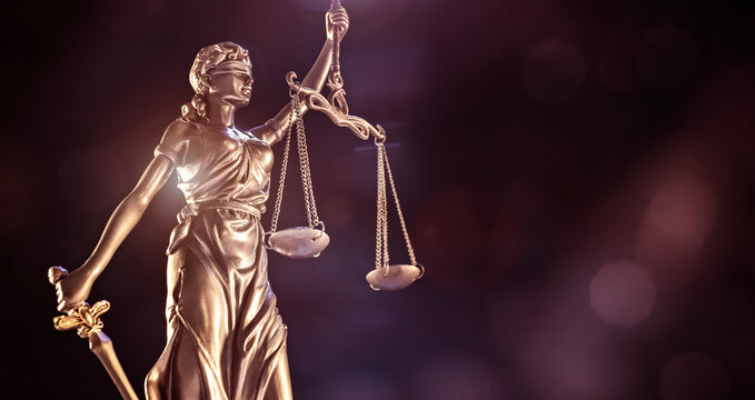 Law and legal background concept statue of Lady Justice with scales of justice