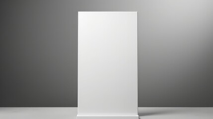 Blank roll up banner stand in grey room.