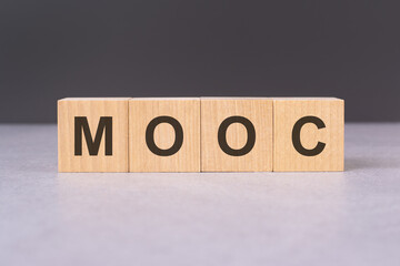 cubes form the word mooc. mooc word concept - finance, market and investment