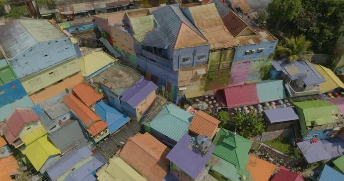 Aerial Upward Shot Of Colorful Residential Houses In Famous Village On Sunny Day - Java, Indonesia