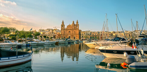 Panoramic view of marina boats and catholic church in Msida. Valletta, Malta