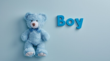 A blue teddy bear leaning against a blue wall with "boy" letters above, baby, boy, gender, baby shower, gender reveal, nursery, pregnancy, pregnant, motherhood, fatherhood, oh baby