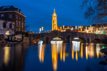 Fototapeta na wymiar City of Roermond, Province Limburg, The Netherlands, view of St. Christopher's cathedral and river Roer in the evening