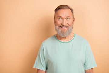 Photo of optimistic positive man with white gray beard dressed teal t-shirt look discount empty space isolated on beige color background