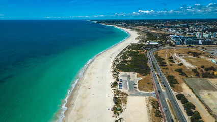 Aerial view of a white sand beach with turquoise water in Port Beach, North Fremantle - Perth, Western Australia