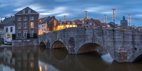 Cityscape of Roermond, Province Limburg, The Netherlands, view of the stone bridge over the Roer river in the evening