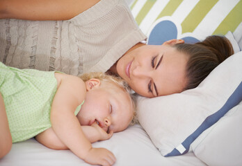 Fototapeta na wymiar Love, sleeping and mom with baby on bed for bonding, relax and sweet cute relationship. Happy, smile and young mother watching girl child, kid or toddler taking a nap in bedroom or nursery at home.