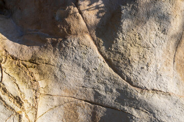 Rock structure of Mount Carmel, cracks illuminated by the sun