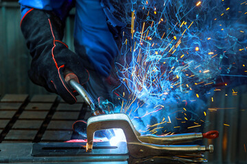 During welding process of argon gas on steel sparks are created that cause smoke to be generated in...