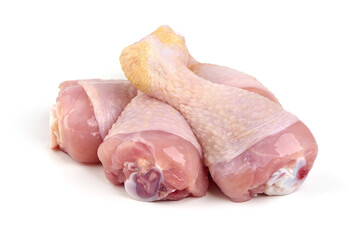 Raw chicken drumsticks, isolated on white background.