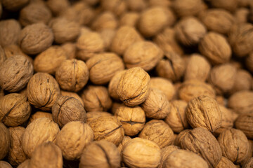 Walnuts on the market. Vegetable protein. Walnut in shell.
