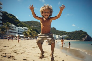 Happy little boy jumping in summer on the beach