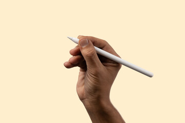 Black male hand holding smart pencil on light beige background, isolated.