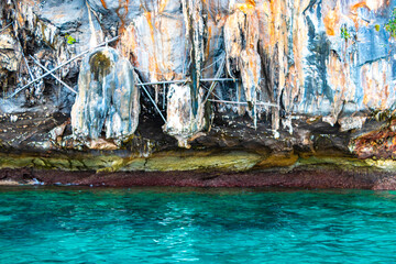 Limestone cave and turquoise blue water Koh Phi Phi Thailand.