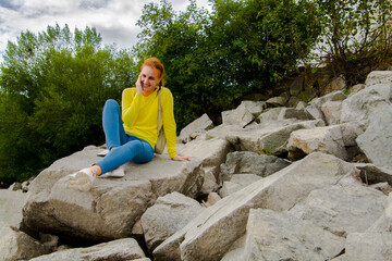 Young woman and stones at Liptovska mara in Slovakia