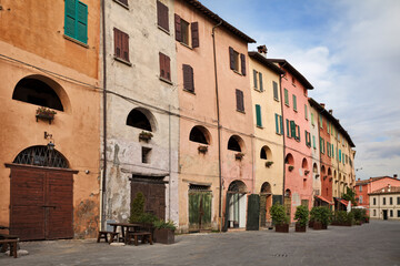 Brisighella, Emilia Romagna, Ravenna, Italy: old palace with colorful wall in the historic center of the ancient Italian town - 707981412