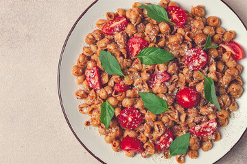 Tuscan pasta with smoked paprika and basil,parmesan cheese, Italian traditional cuisine,