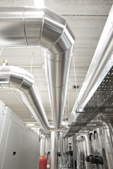 HVAC system pipes, handling heating, ventilation, air conditioning, and cooling, are located on the...